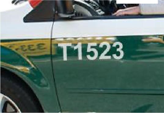 Taxi image with T in front of the Medallion number 1523.