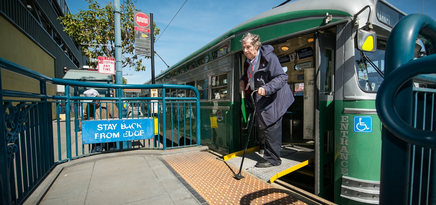 Passenger exits a streetcar onto the ramp