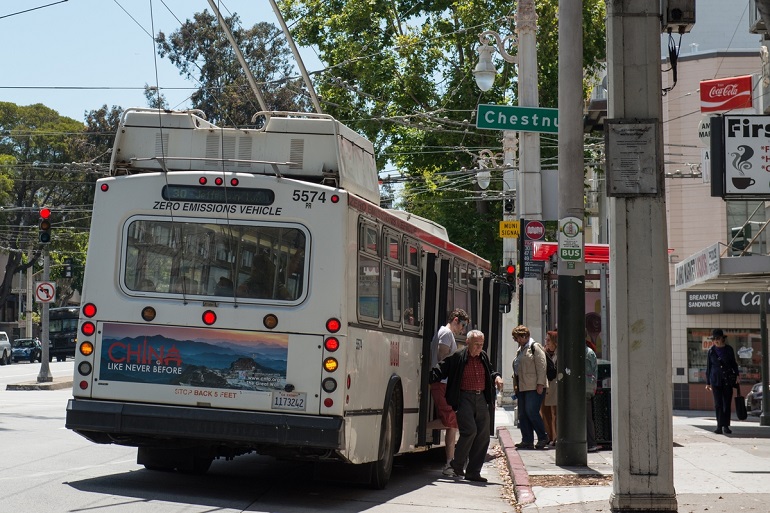 30 Stockton trolley bus waits for customers at Van Ness and Chestnut.
