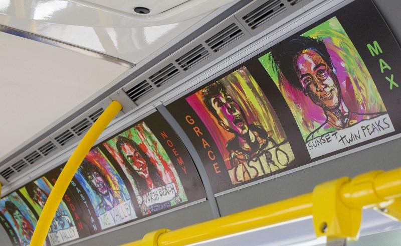 Artwork displayed in advertisement slots on a Muni bus.