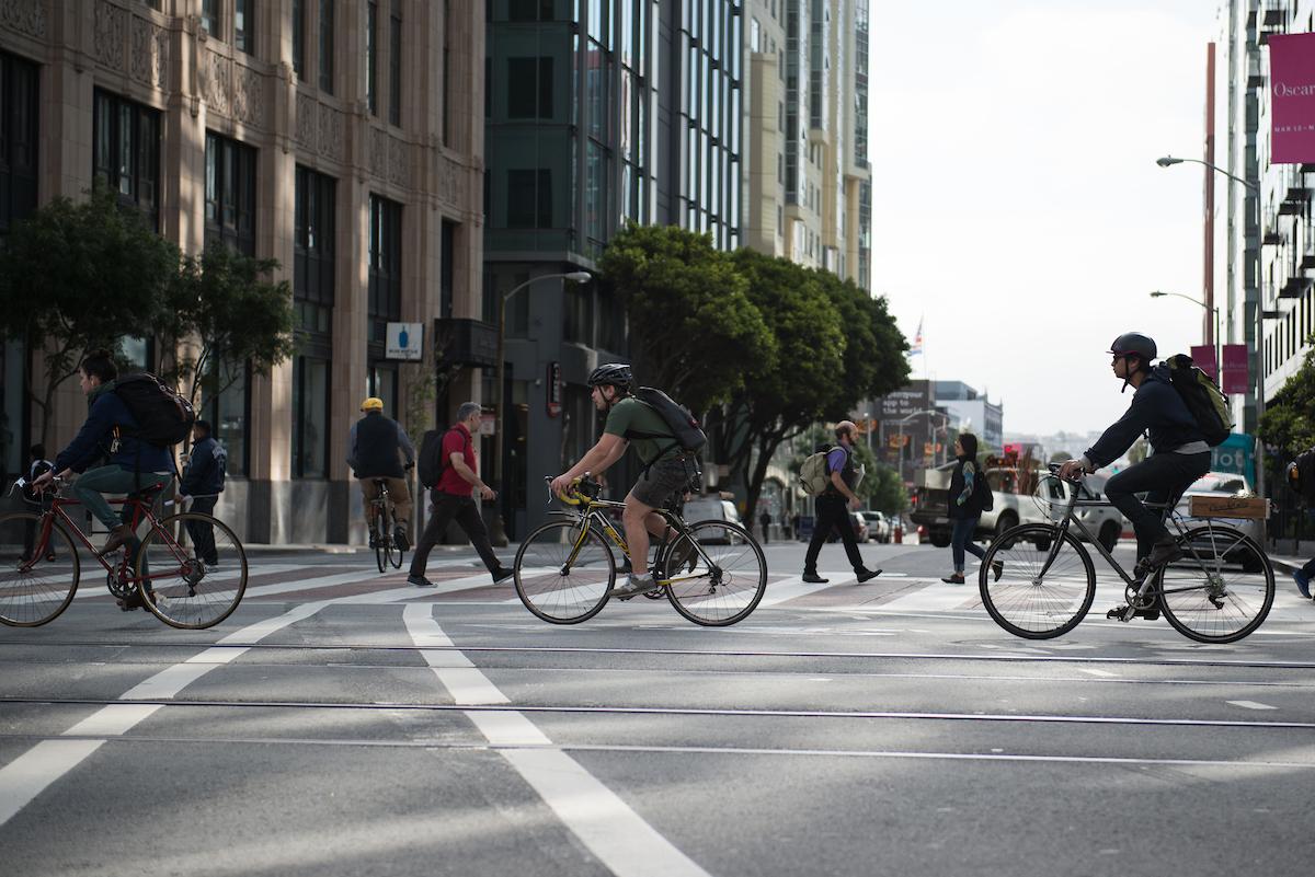 Bicyclists crossing 10th St