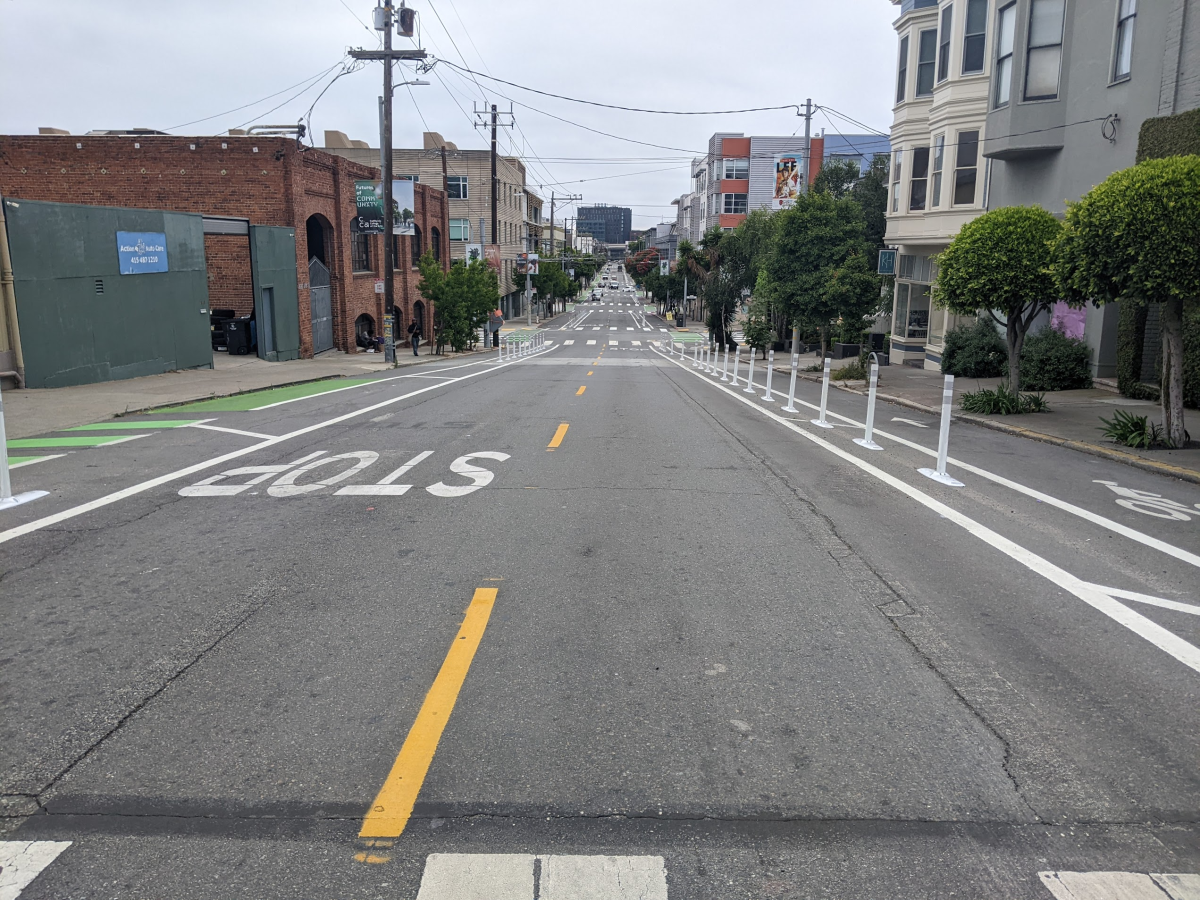 View looking east on 17th Street at Vermont Street showing the completed quick-build project, including delineator-separated bike lanes on each side of the street
