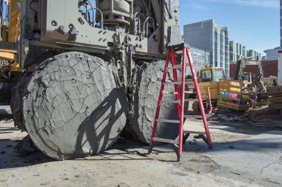 At the future Yerba Buena/Moscone Station site, a hydromill needs cleaning due to dense clay and rocks becoming lodged between the rotating discs. 