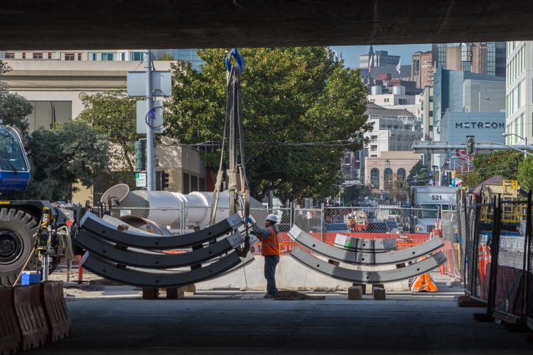 On the surface, crews prepare tunnel segments to be lowered underground. Southern SoMa