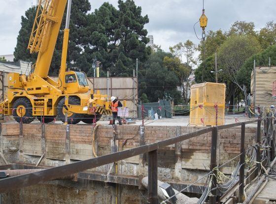 At 1731-1741  Powell Street, the construction crew continues restoring the retrieval shaft site.