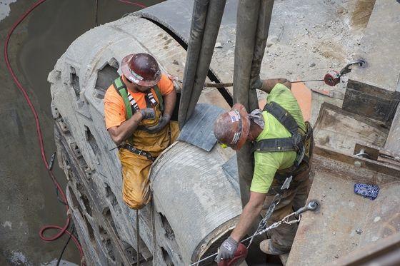 The construction crew works at harnessing tunnel boring machine (TBM) Mom Chung's cutterhead.