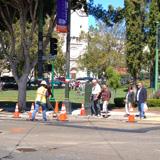 People and construction equipment on Union Street at a temporary bus stop location