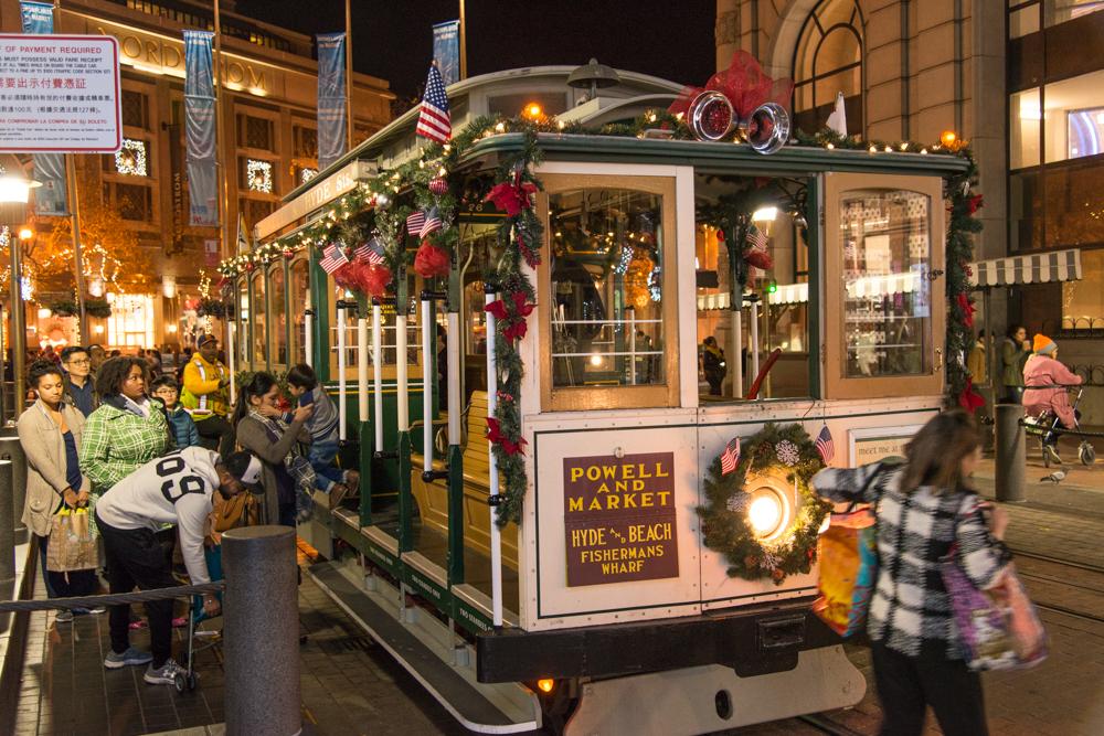 decorated cable car and passengers