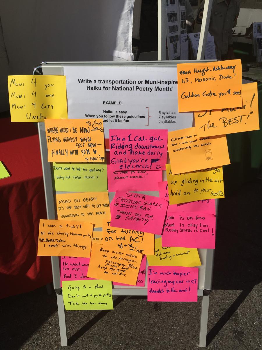 Board covered with poems written on brightly colored paper