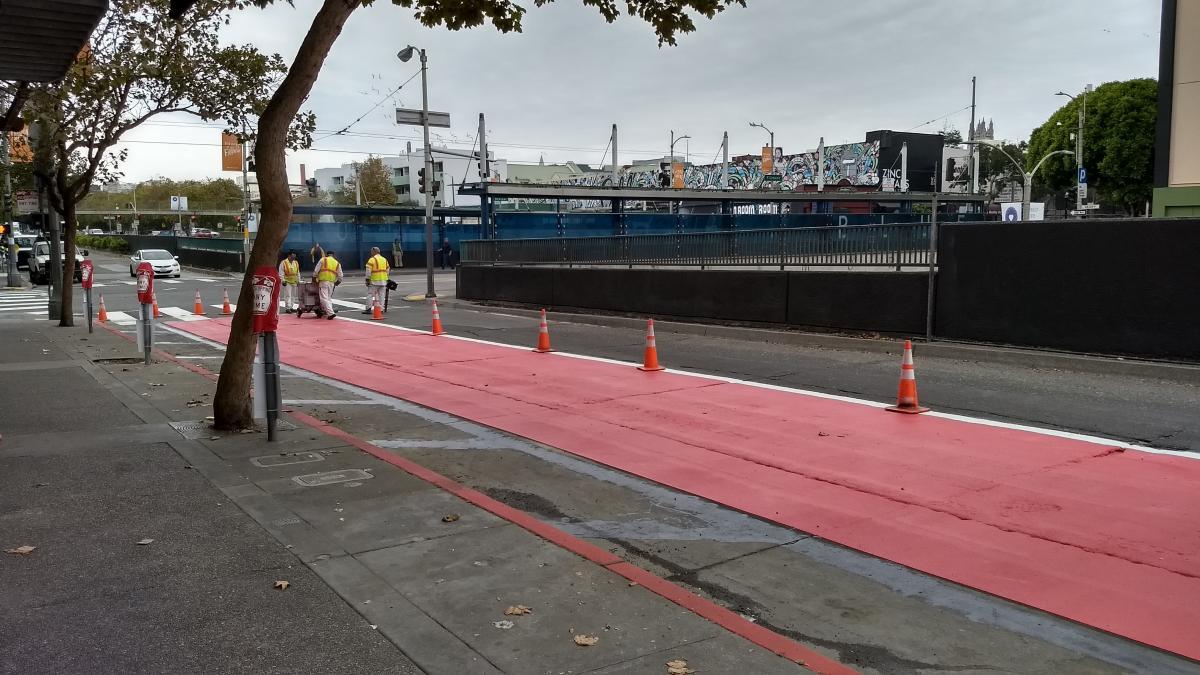 Red lanes being painted on Geary.