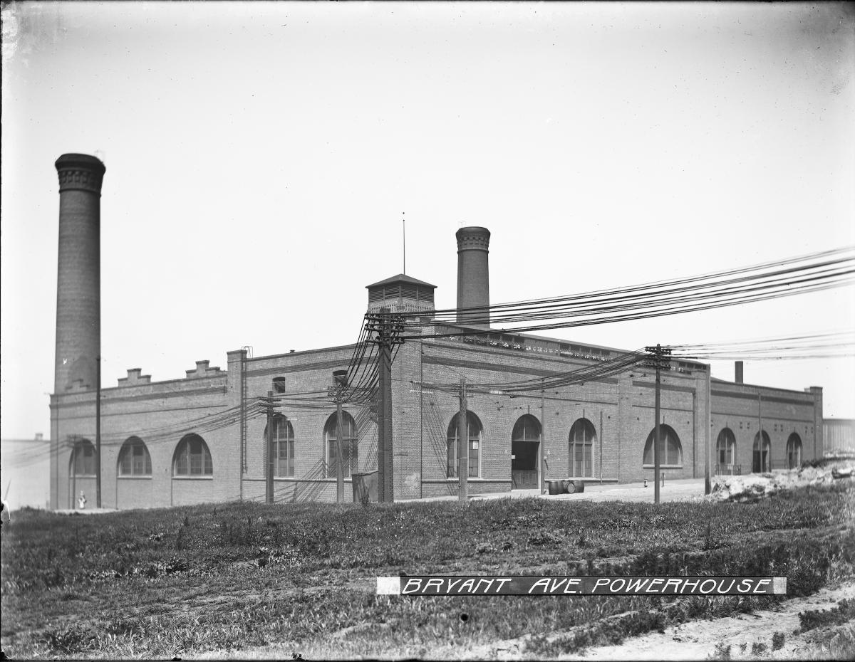 brick building with smokestacks and arched windows