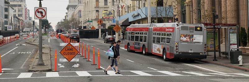 Buses picking people up on Van Ness.