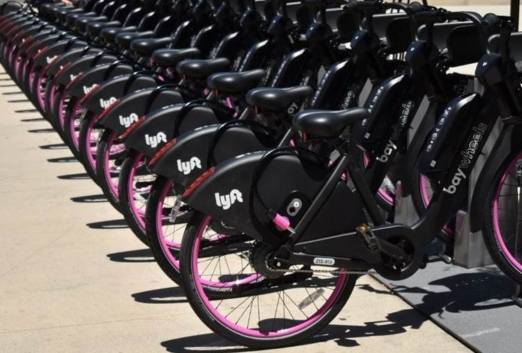 new lyft e-bikes docked at staions
