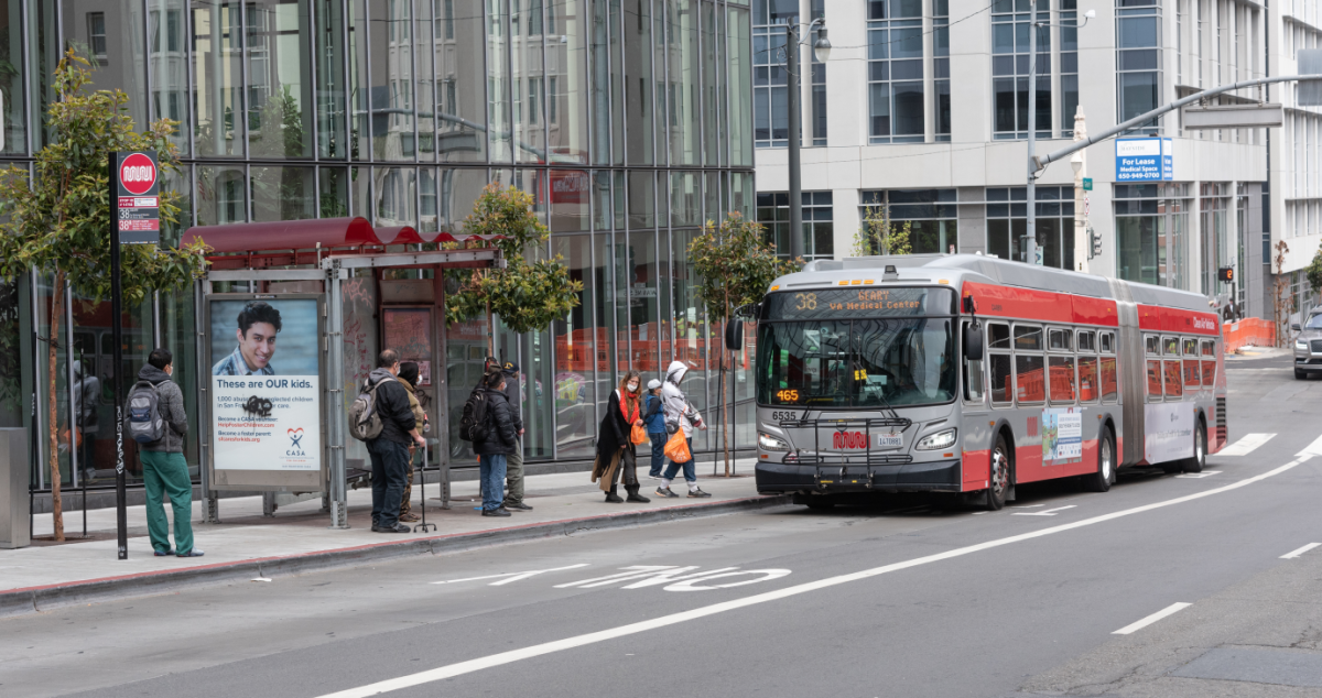 Passengers board 38 Geary on Geary at Van Ness