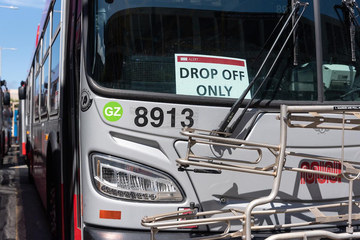 Muni bus with a "Drop Off Only" sign