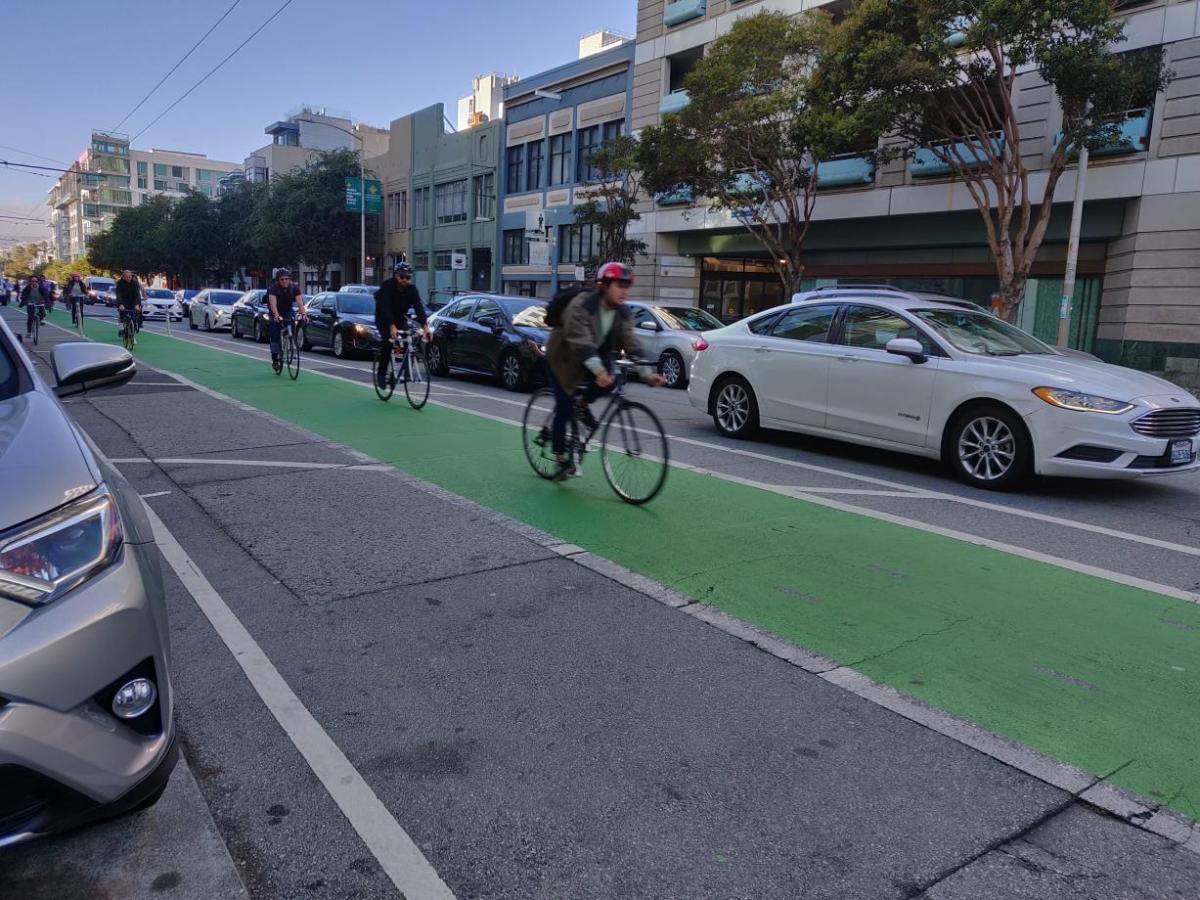 Bikers using the bike lanes on Folsom Street