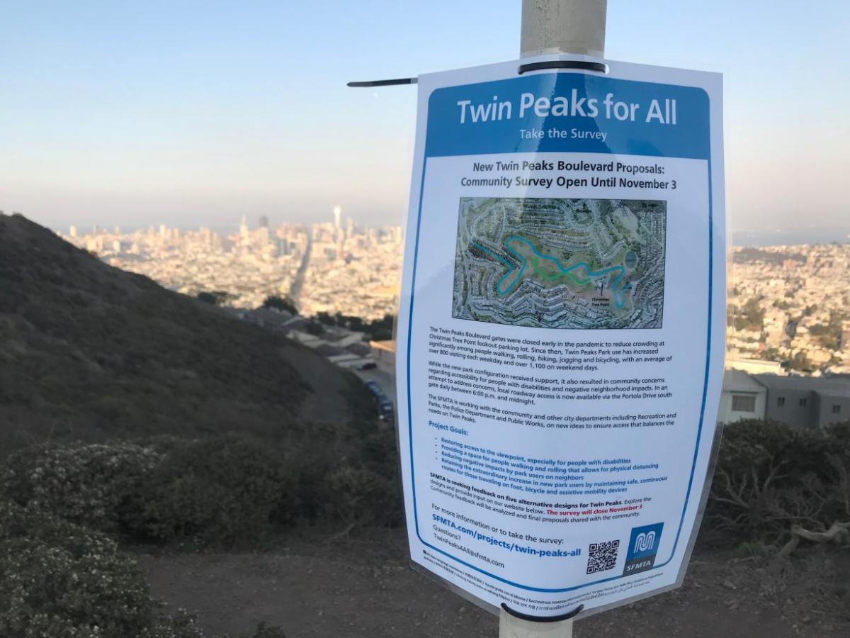 Twin Peaks flyer on top of Twin Peaks overlooking San Francisco