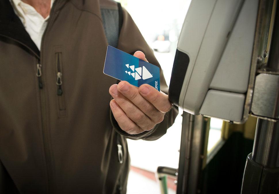 A customer pays their fare with a clipper card