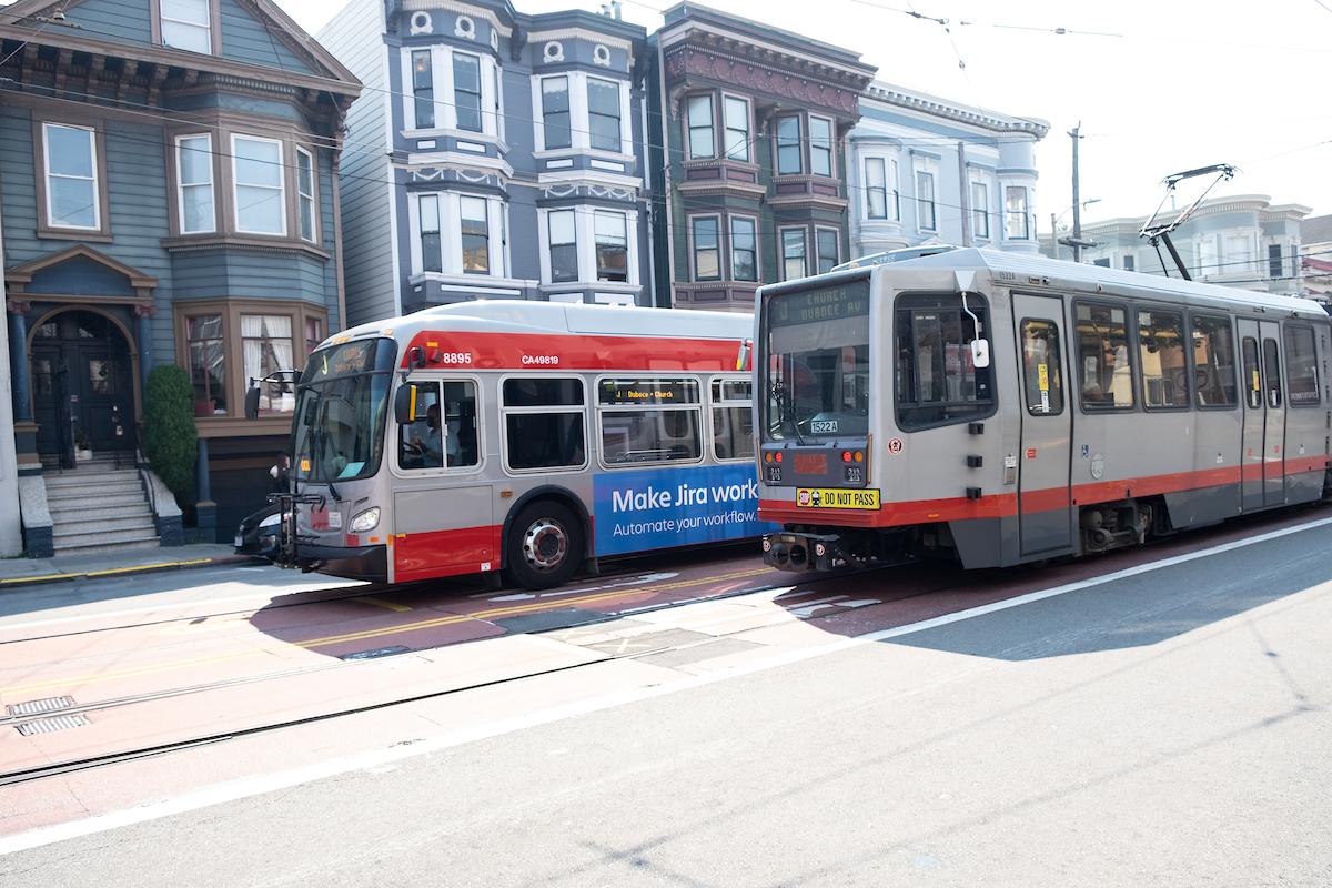 Photo of a Muni bus and Muni Metro side by side