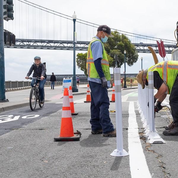Sign Shop Crew Installing Safe Hit Posts Along New Bicycle Lanes on Embarcadero 