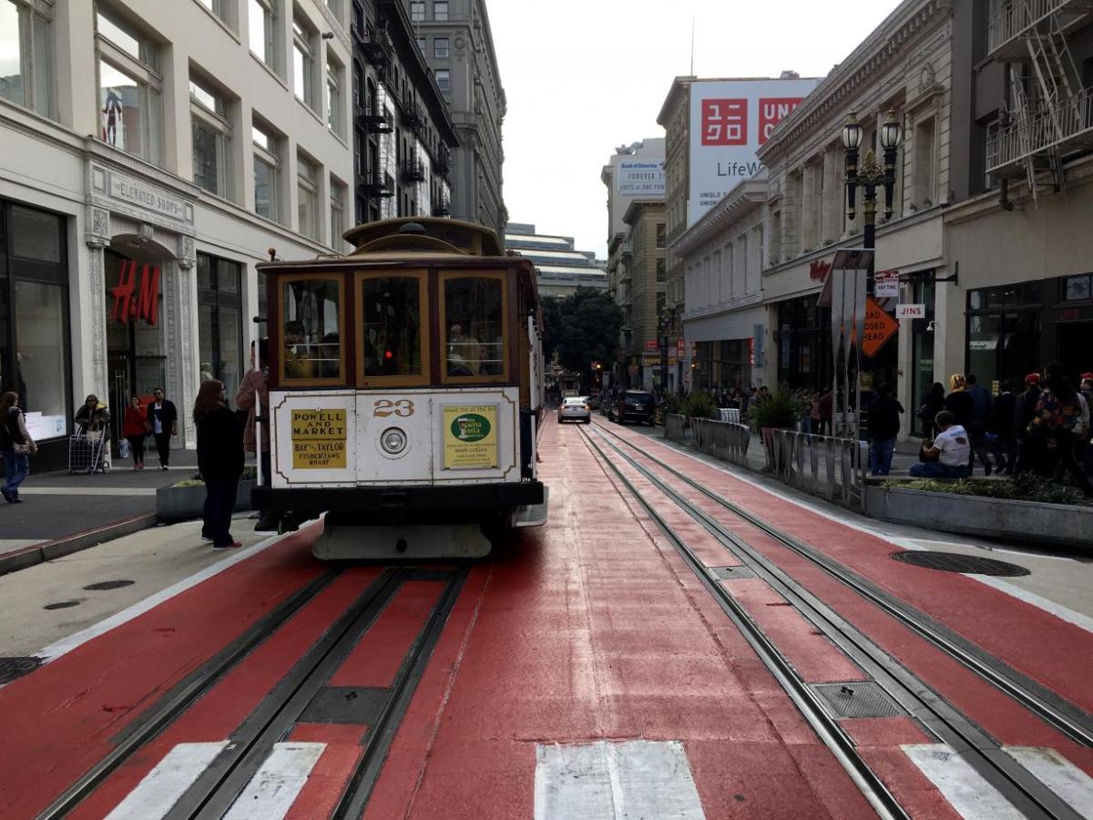 Image of a person boarding a cable car on Powell Street