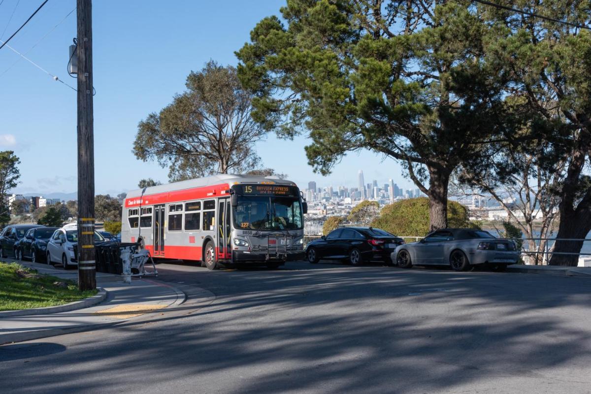 Muni line 15 with the San Francisco skyline in the background