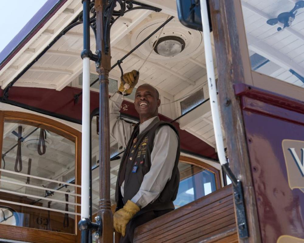 A cable car conductor rings the bell as part of the 2017 contest