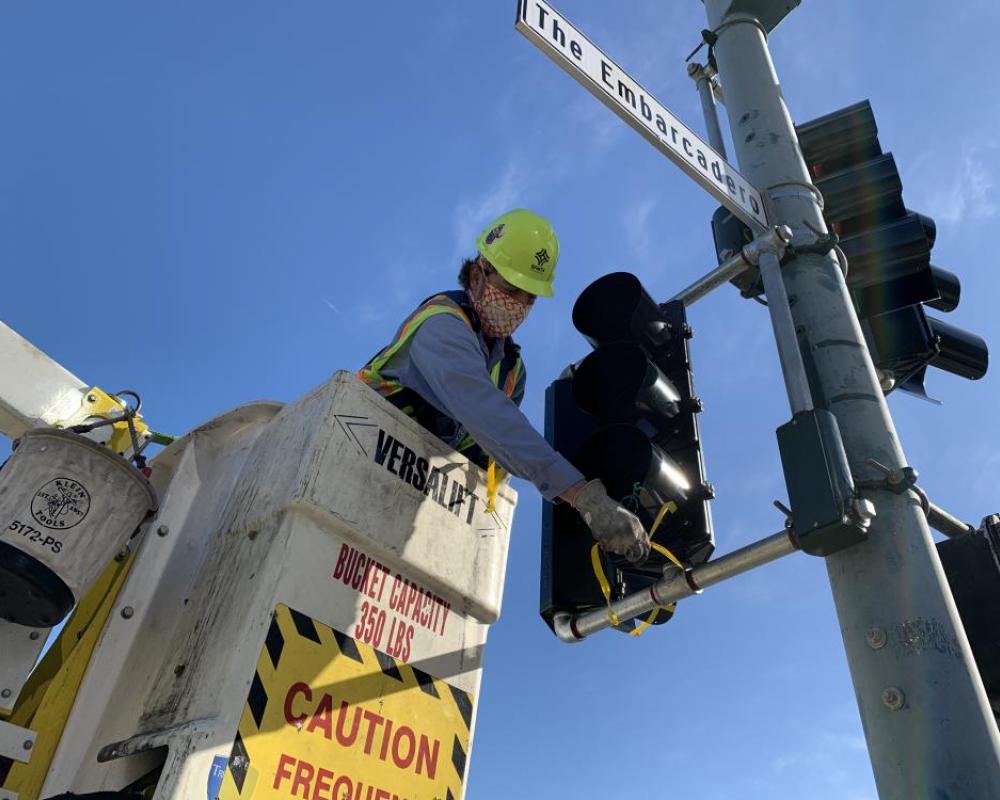 SFMTA crews installing a bike signal