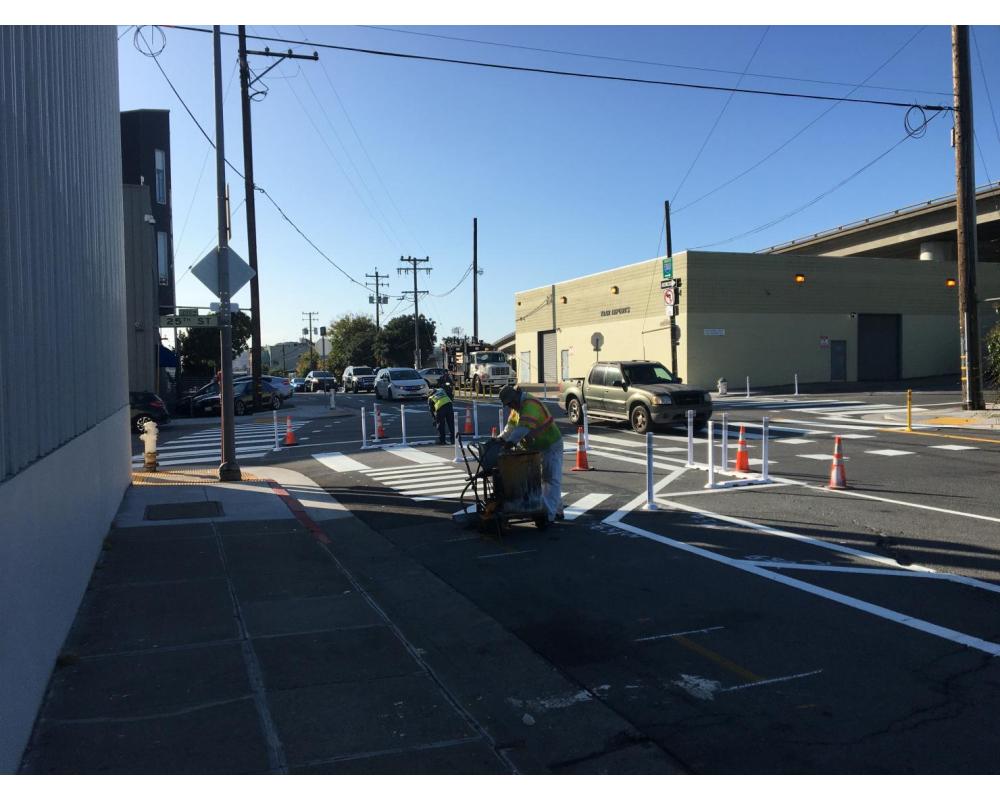 Paint Shop crew members working on striping changes at the intersection of Indiana & 25th