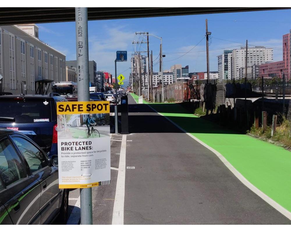 Photo of freshly paved green protected bikeway between 5th and 7th streets - June 2019