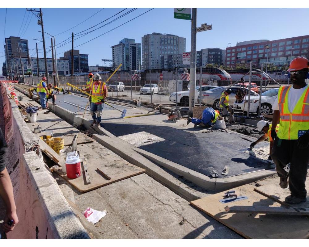 Photo of crews building the sidewalk boarding island at 5th Street - October 2019