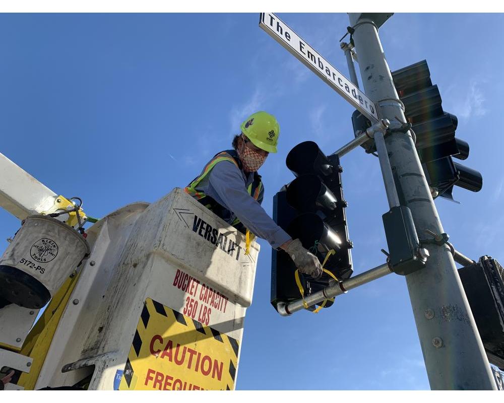 SFMTA crews installing a bike signal