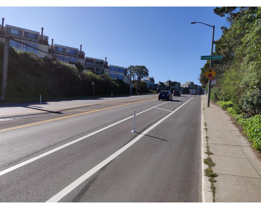 Clipper Street looking uphill with protected bikeway
