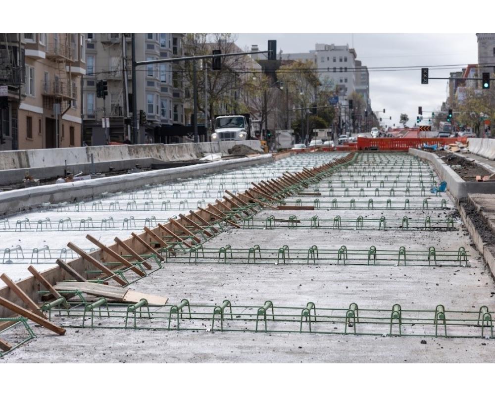 Photo of roadway under construction with cement base with rebar on Van Ness Avenue