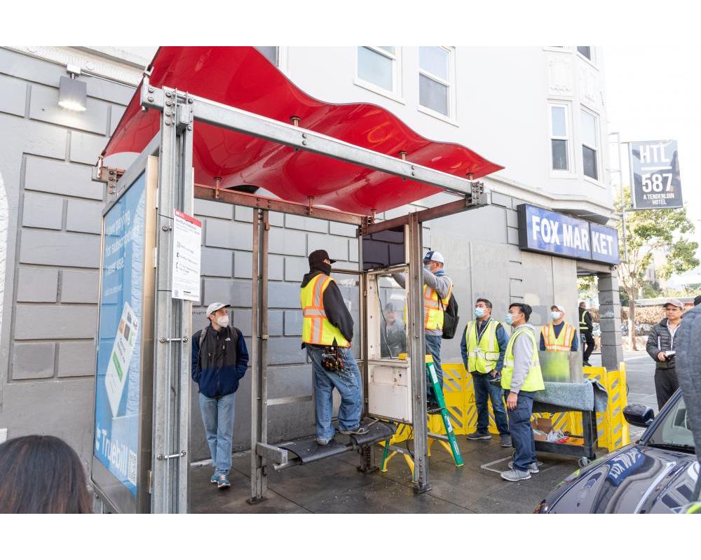 Crews testing the new customer information sign 