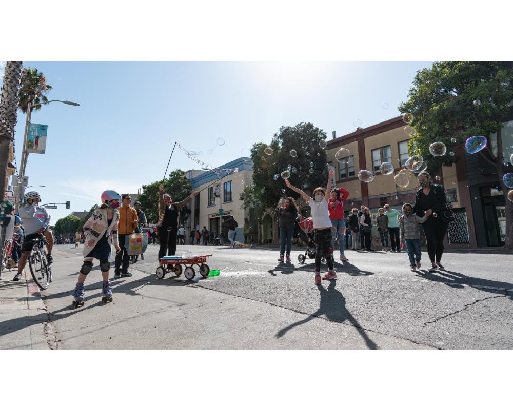 Children and families celebrate open streets in San Francisco during Phoenix Day.