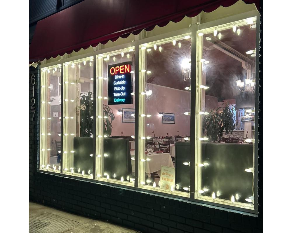 Image of decorative lighting in the windows of Great India Ocean Cuisine on Geary.