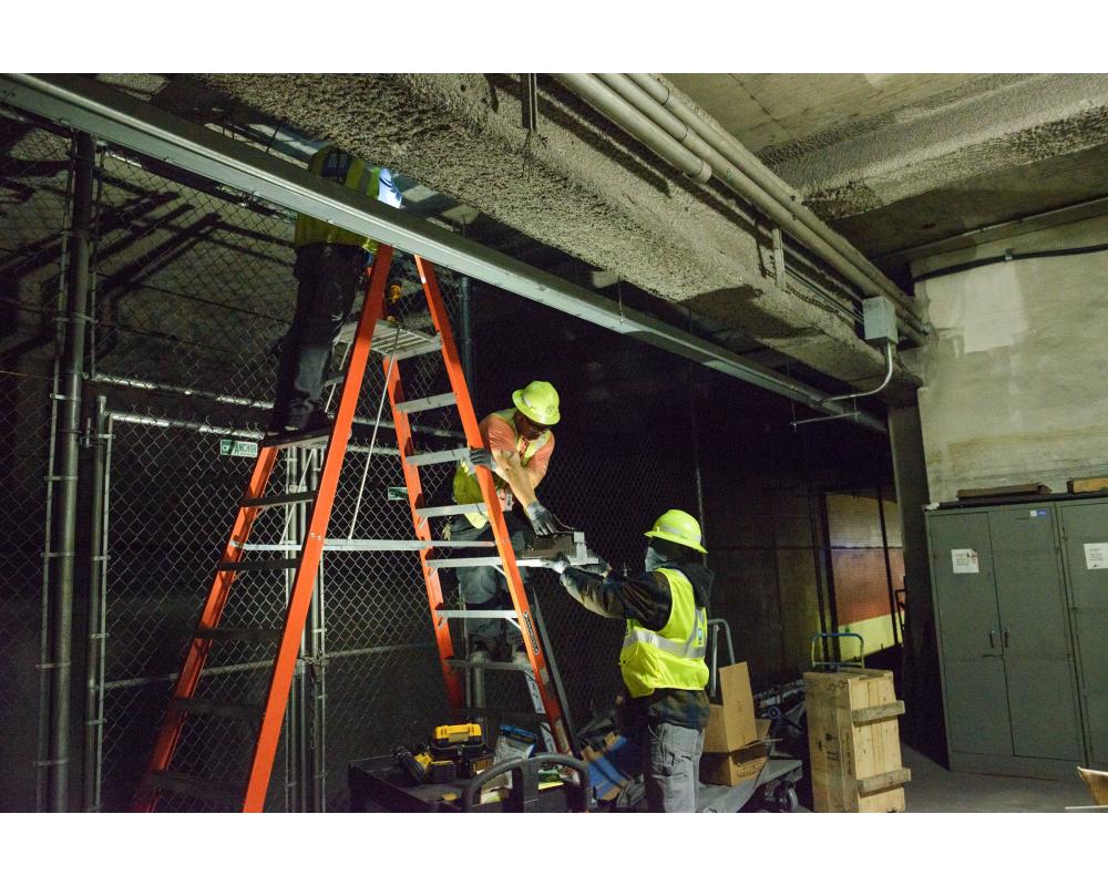 Mechanical Systems crew replacing lighting at Powell Station.