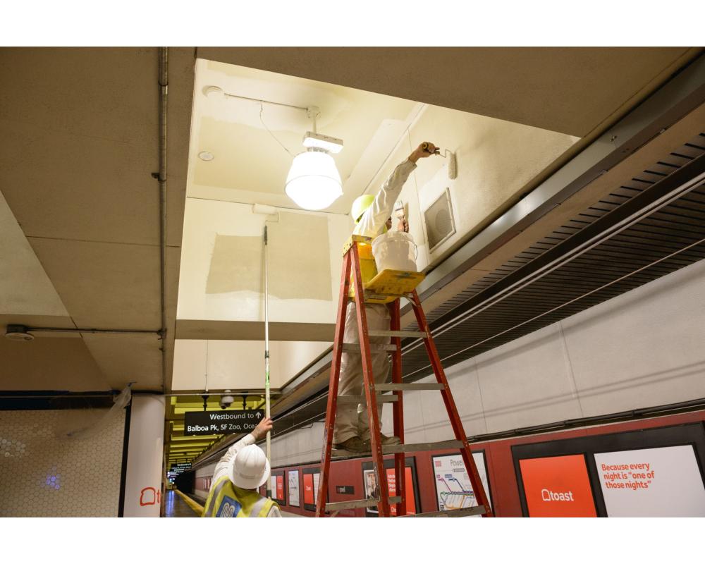 Paint Shop crew painting ceiling in Powell Station.