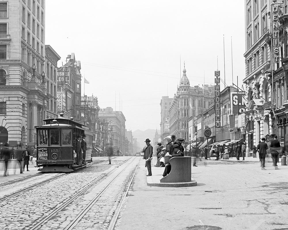 Looking west on Market Street from 3rd Street with a cable car on the left and a waiting station on the right in January 1906.