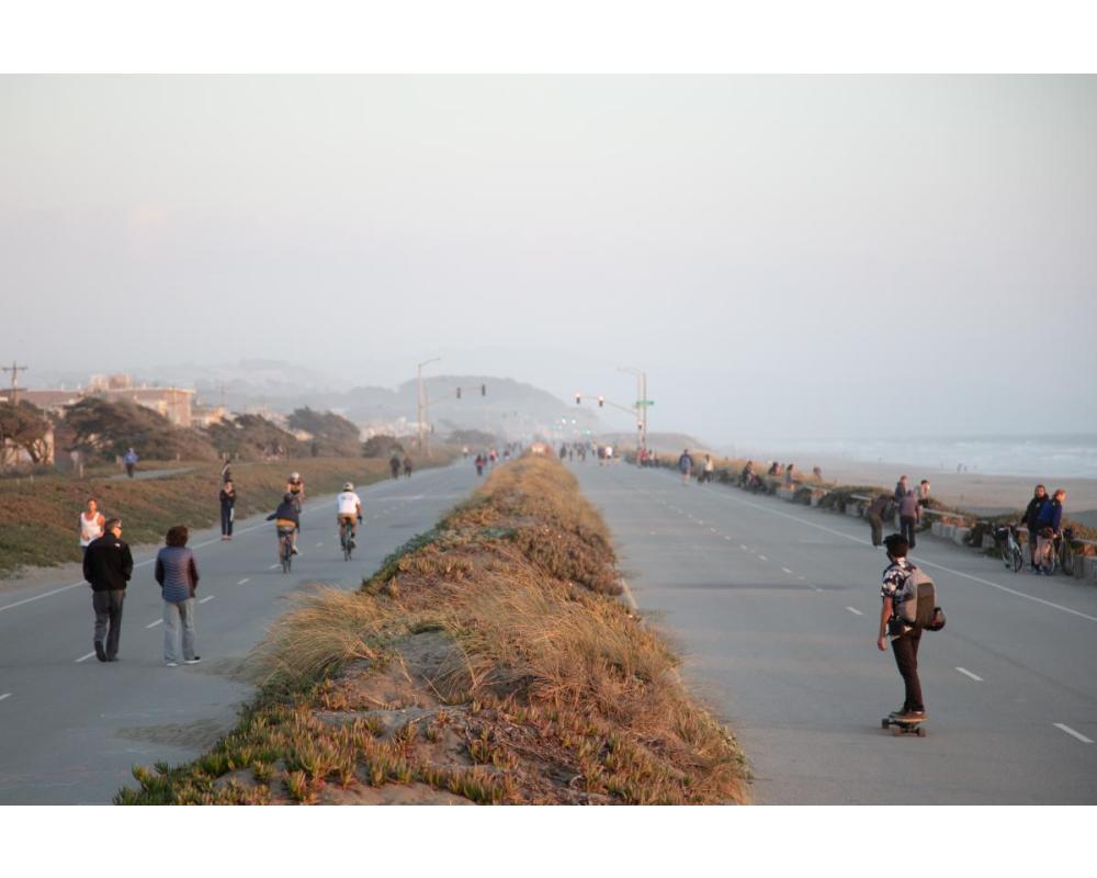 People walking, biking, and rolling along the Upper Great Highway when closed to vehicles