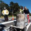 Supervisor Vallie Brown striping a crosswalk
