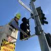 SFMTA crews installing a bike signal