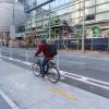 person biking in a two-way protected bikeway