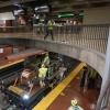 MOW crews install new wires while custodians complete a deep clean of the Mezzanine at Castro Station