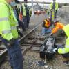 MOW personnel install a new switch machine to make trains safer, faster, and more reliable.