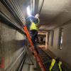Subway engineers from Mechanical Systems restore and replace lighting systems throughout the tunnel