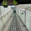 Muni Metro train tracks leading into a tunnel opening