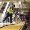 Custodial staff cleaning Embarcadero Station platform.