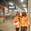 Ambassadors at West Portal Station assisting customers with wayfinding.